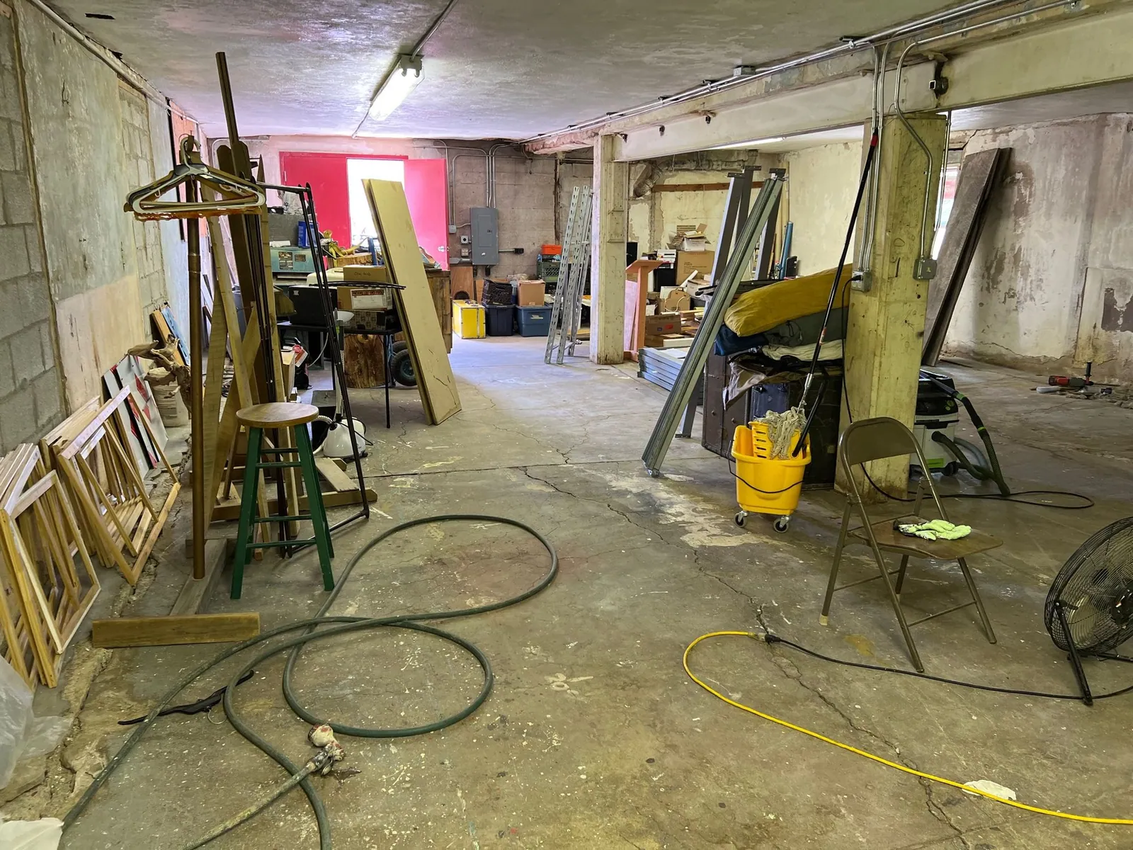 A large basement filled with junk.